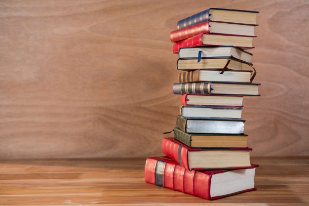 stack-various-books-table_1252-710